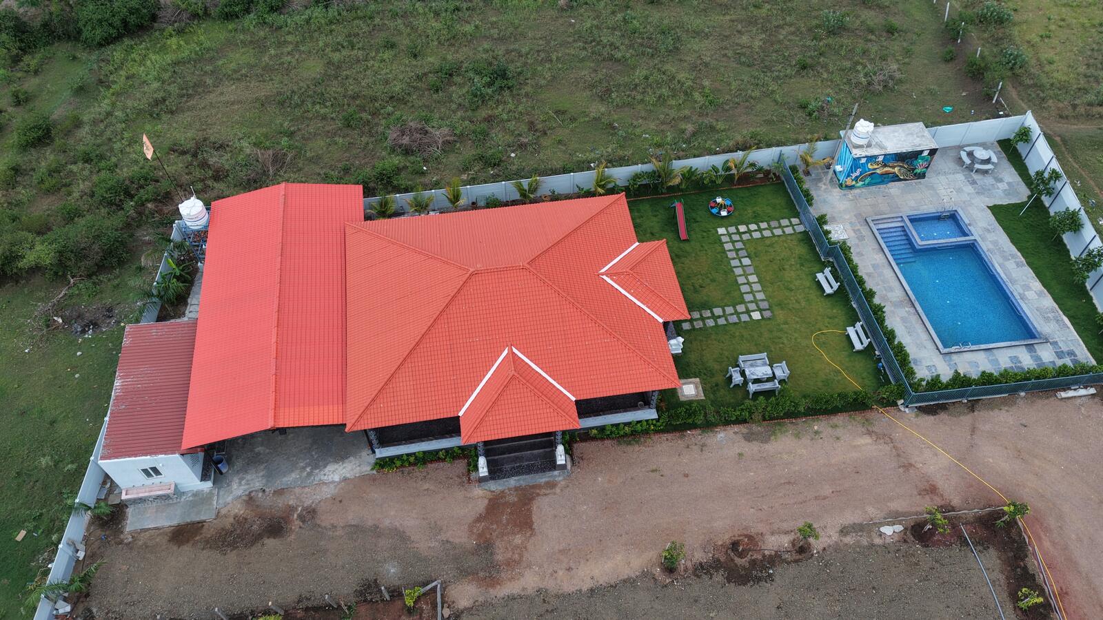 Aerial view of LP Nature Nest farm house with private pool and garden