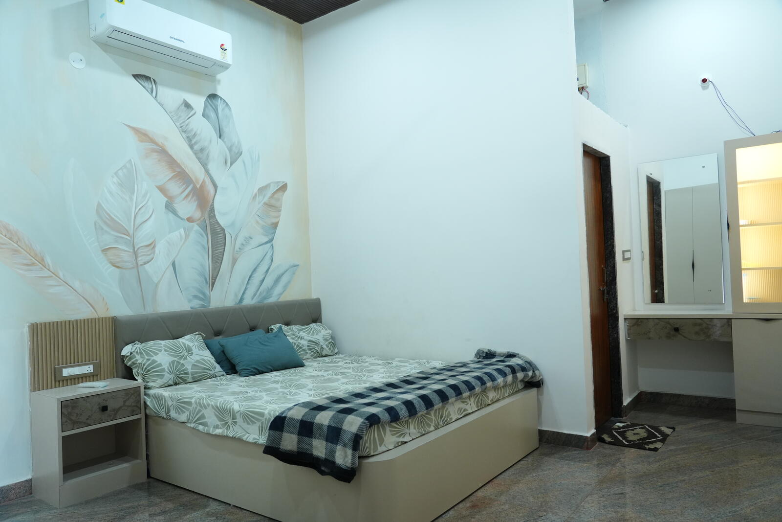 Master bedroom with mural wall at LP Nature Nest