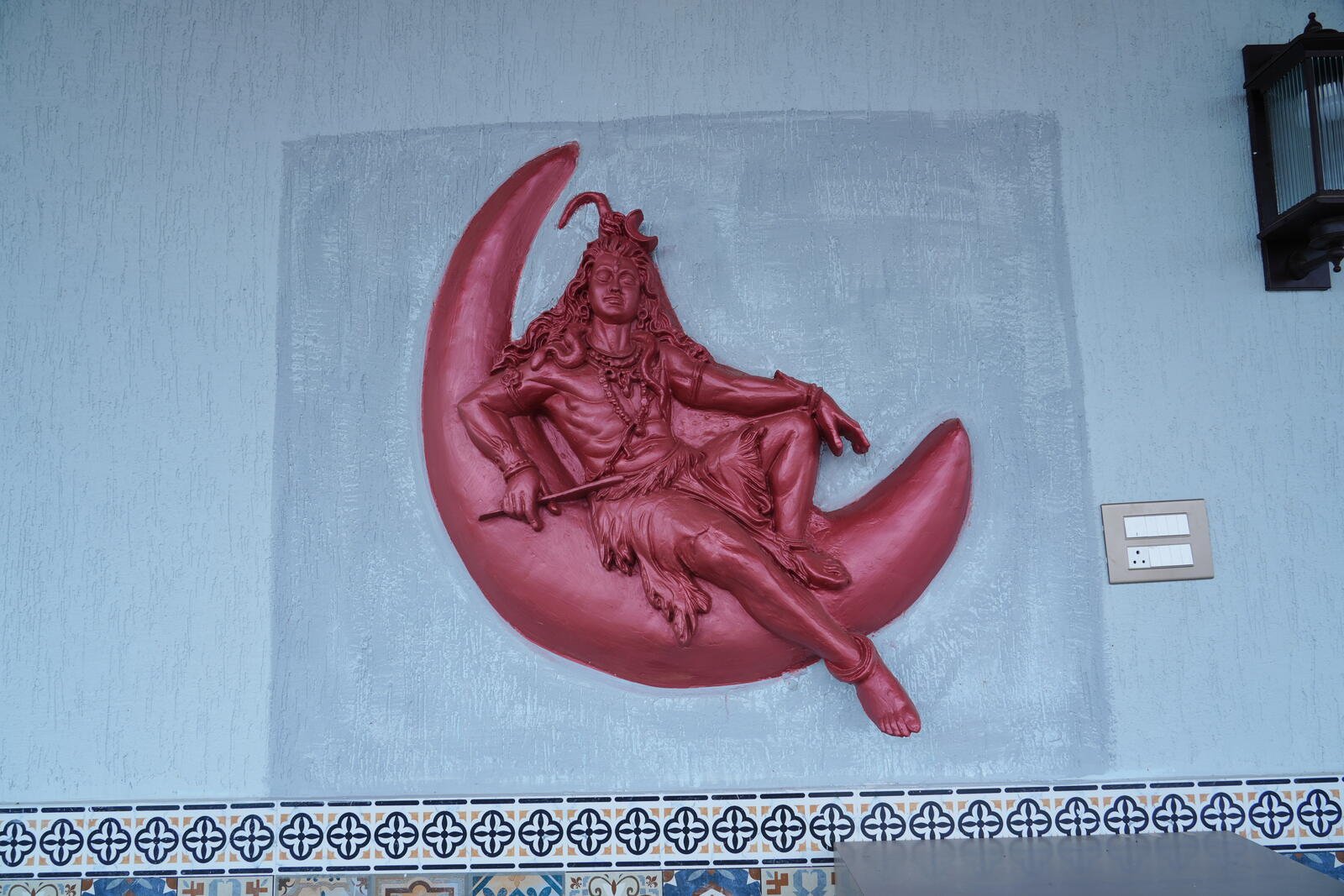 Hand-painted wall relief of Lord Shiva at LP Nature Nest